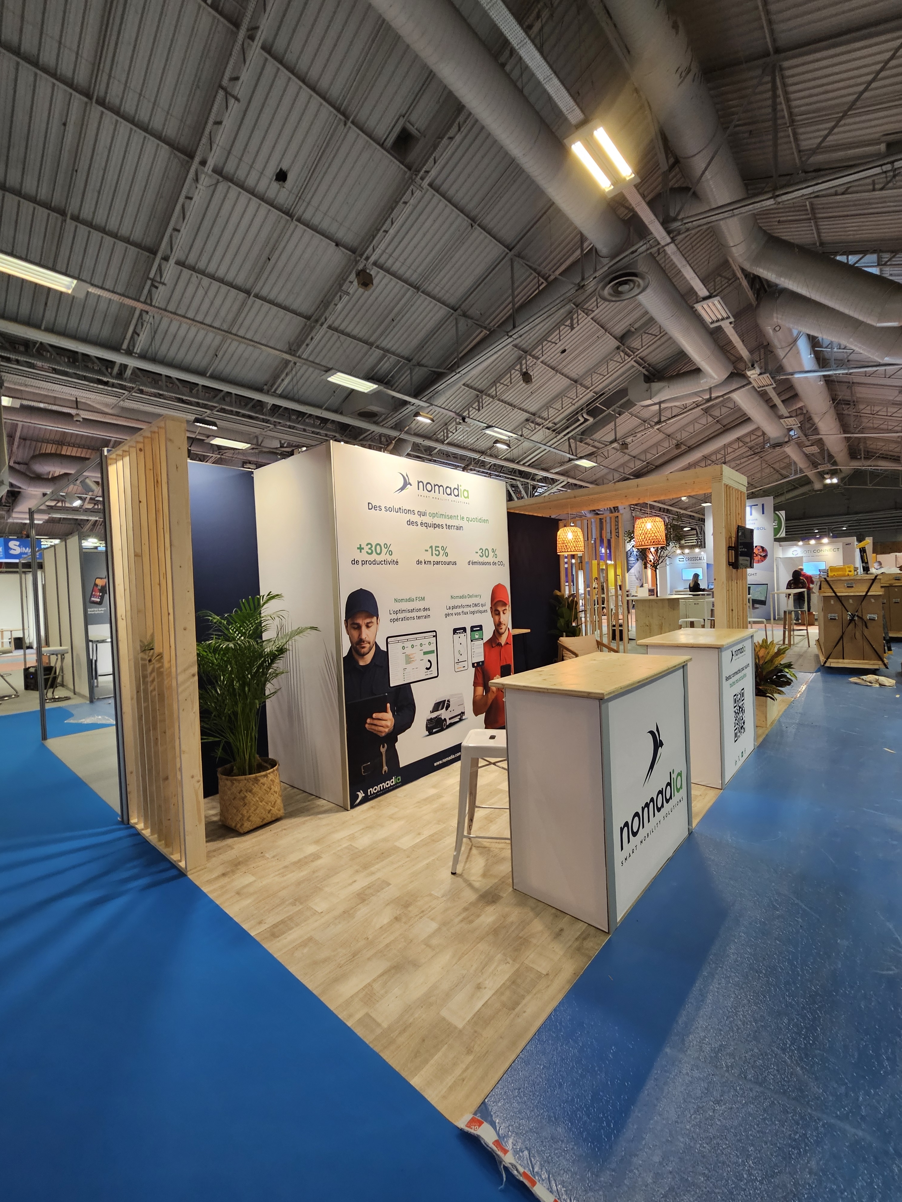Stand de Nomadia au salon Mobility For Business 2025 avec lino effet parquet